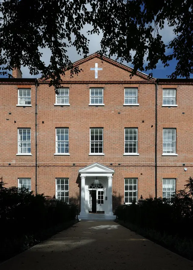 The restored Georgian listed building at Bailgate Court at dusk